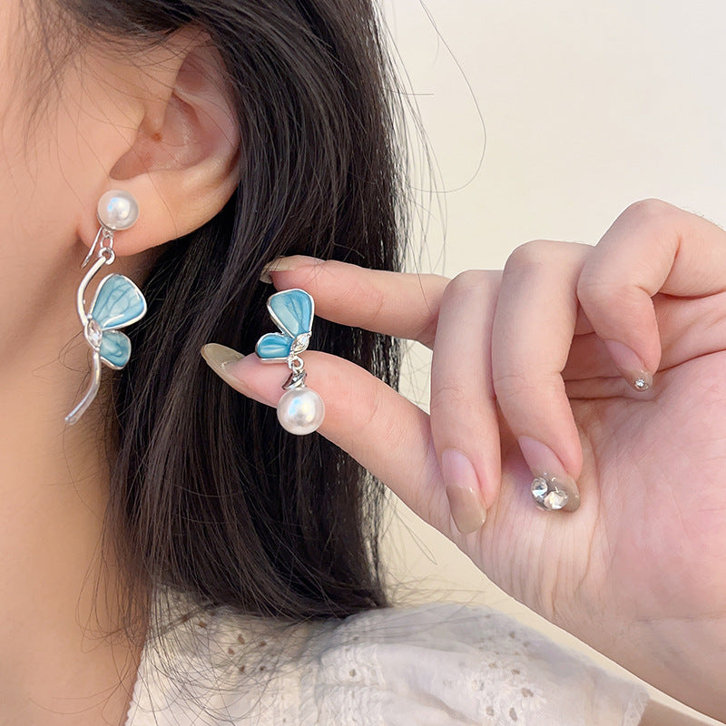 Asymmetrical Blue Butterfly Clip-On Earrings